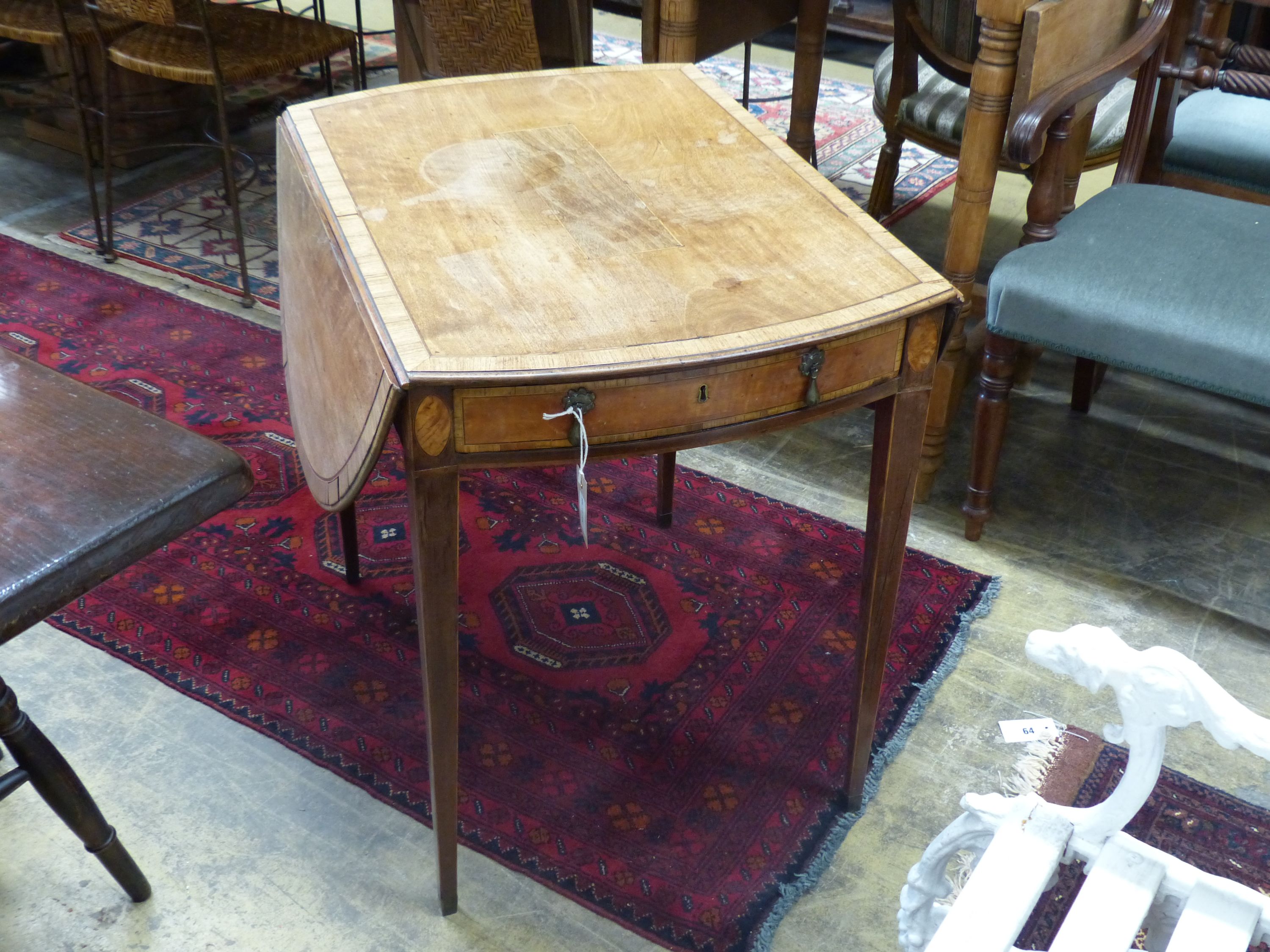 A George III mahogany oval pembroke table